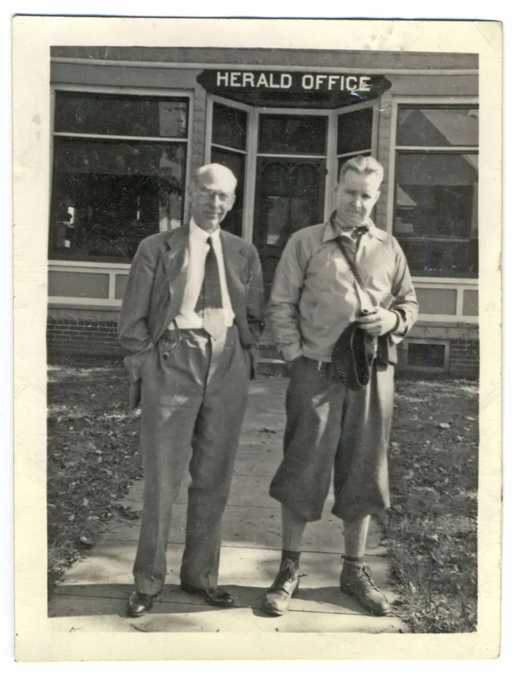 Luther Johnson and John Drysdale outside the Herald offices.